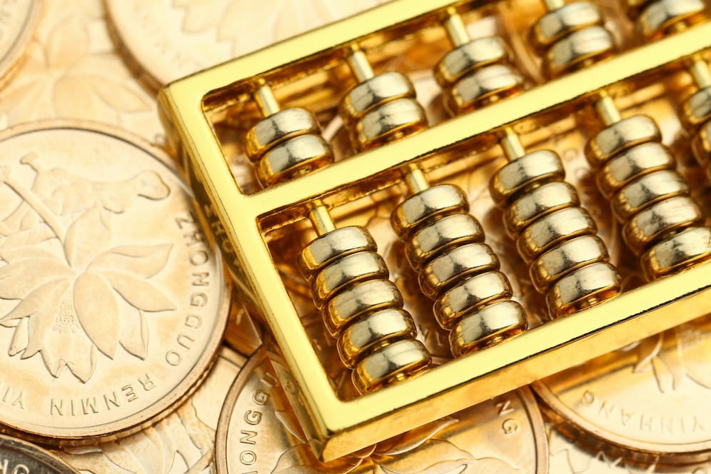 golden abacus with chinese rmb gold coins as background 1387 2